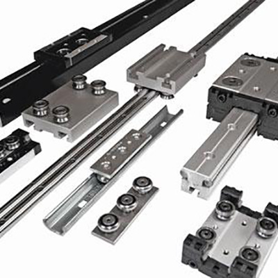 linear motion carriages and rail assemblies
